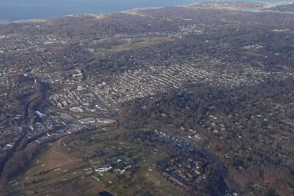 Aerial view of Glen Cove's wooded neighborhoods along the Long Island Sound shore, New York