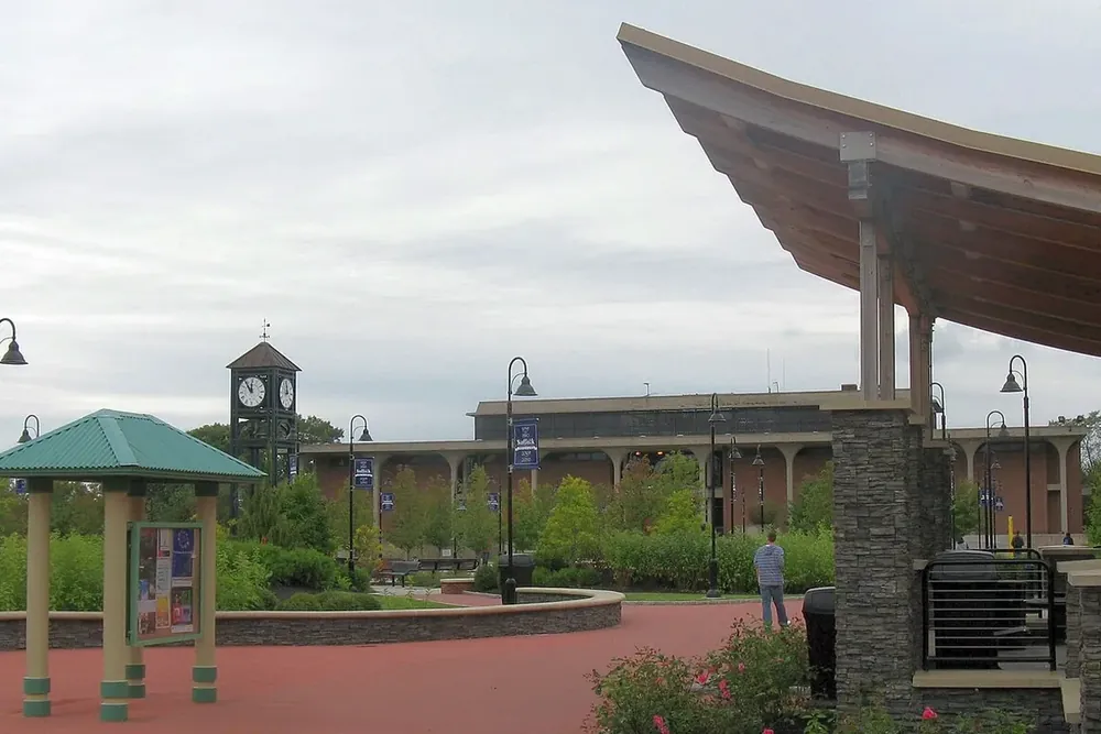 College campus plaza with a covered pavilion and clock tower in Selden, New York