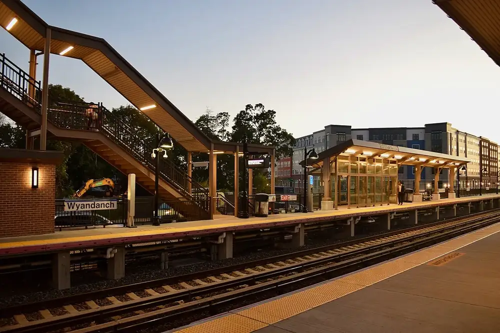 Covered train platform and footbridge at the Wyandanch station at dusk, New York